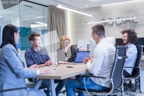 Image of Startup Business Team At A Meeting at modern office building
