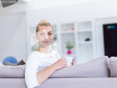 Image of woman enjoying a cup of coffee