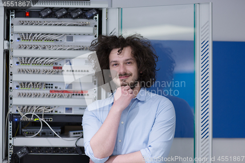 Image of business man engeneer in datacenter server room