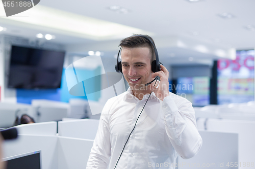 Image of male call centre operator doing his job