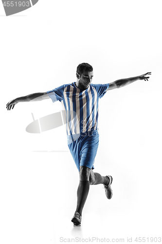 Image of Professional football soccer player in action isolated on white background