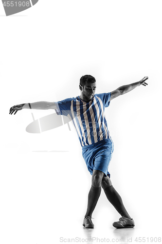 Image of Professional football soccer player in action isolated on white background