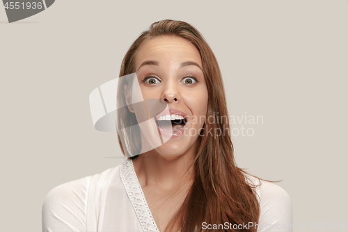 Image of Beautiful woman looking suprised isolated on white