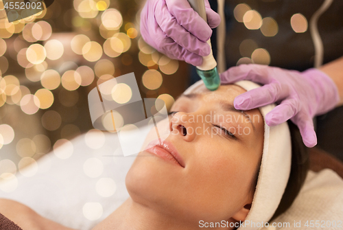 Image of woman having microdermabrasion facial treatment