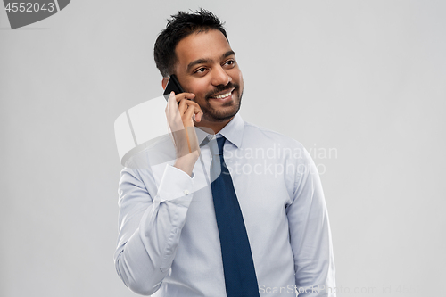 Image of indian businessman calling on smartphone