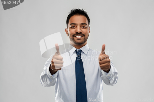 Image of indian businessman showing thumbs up