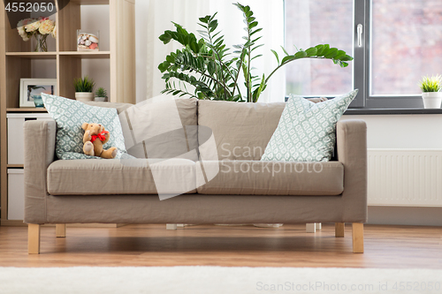 Image of sofa with cushions at cozy home living room