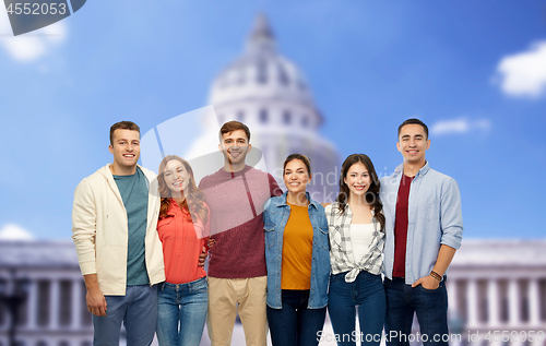 Image of group of smiling friends over capitol building