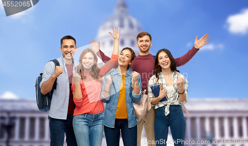 Image of happy students celebrating over capitol building