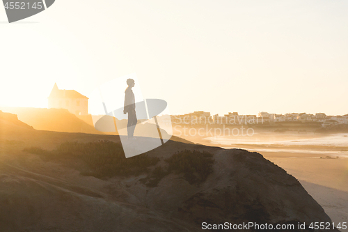 Image of Woman over the cliff