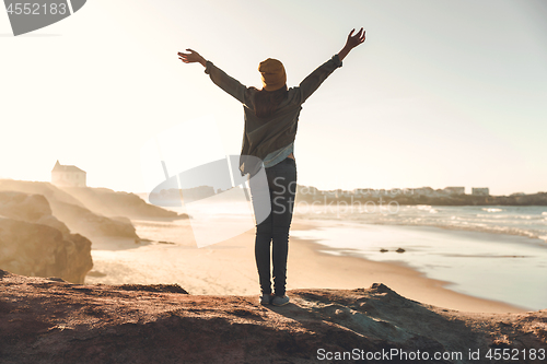 Image of Woman over the cliff