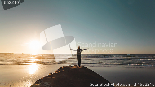 Image of Woman with arms raised