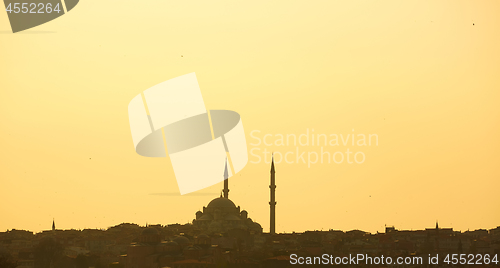 Image of Silhouette of a mosque on a background of mountains. Background