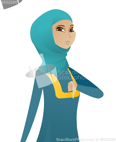 Image of Disappointed muslim business woman with thumb down