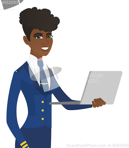 Image of Young african-american stewardess using laptop.