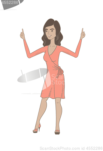 Image of Young hispanic woman standing with raised arms.