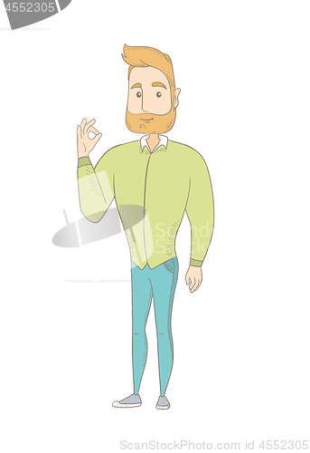 Image of Young caucasian hippie man showing ok sign.