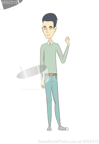 Image of Young asian man showing ok sign.