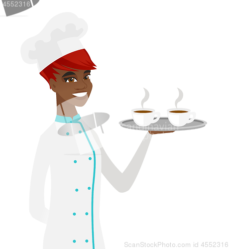 Image of Young african-american chef holding tray with cups