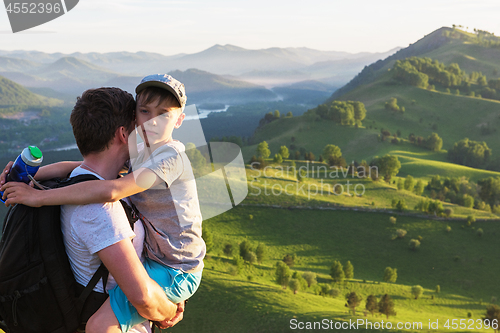 Image of Happy father and son in the Altai mountains