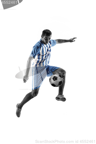 Image of Professional football soccer player with ball isolated on white background