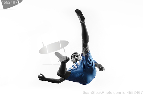 Image of Professional football soccer player in action isolated on white background