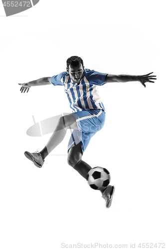 Image of Professional football soccer player with ball isolated on white background