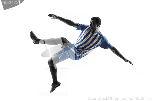 Image of Professional football soccer player in action isolated on white background