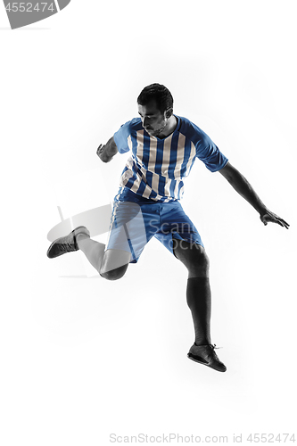 Image of Professional football soccer player in action isolated on white background