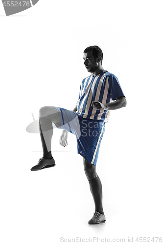 Image of Professional football soccer player in action isolated on white background