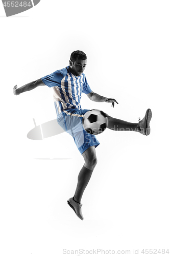 Image of Professional football soccer player with ball isolated on white background
