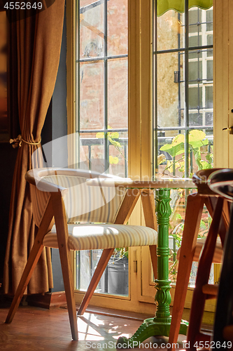 Image of cozy interest, an armchair and a round table