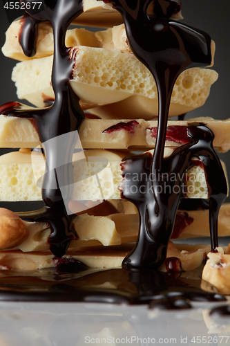 Image of syrop pouring onto a piece of chocolate