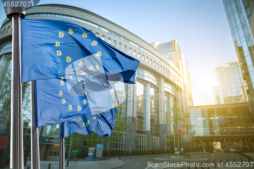 Image of Symbol bitcoin on the blue flag, Regulation of the crypto currency by the European Union