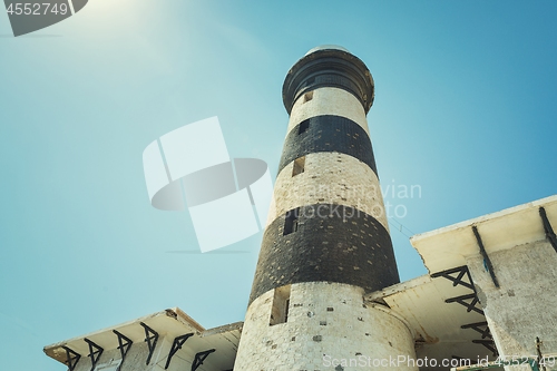 Image of Tall lighthouse on the sea