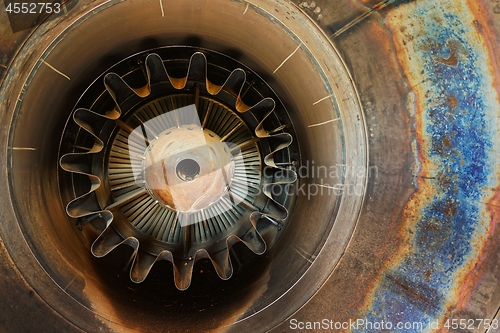 Image of Rusty old jet engine closeup as background