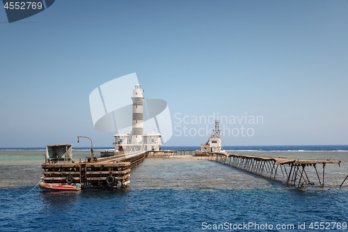 Image of Tall lighthouse on the sea