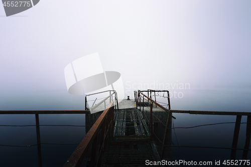 Image of Damaged pier in the mist at morning