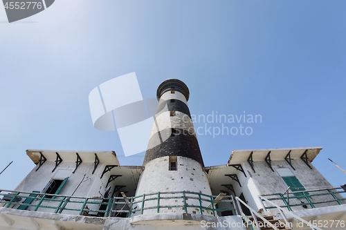 Image of Tall lighthouse on the sea