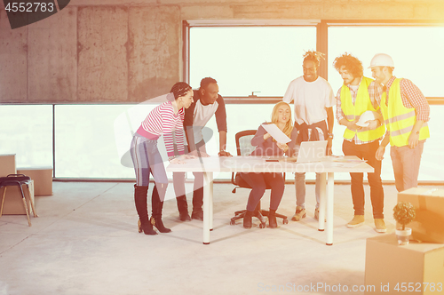 Image of multiethnic business people on construction site