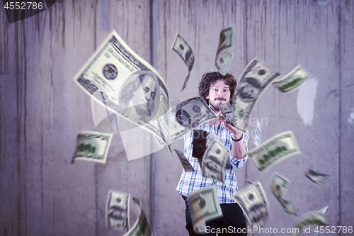 Image of businessman making the rain of money