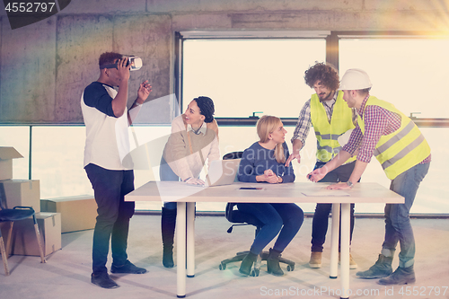 Image of group of multiethnic business people on construction site