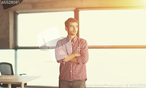 Image of portrait of young casual businessman on construction site