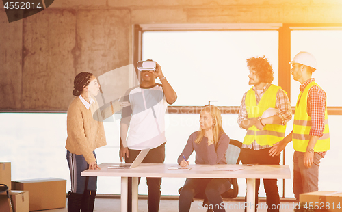 Image of group of multiethnic business people on construction site