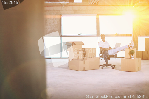 Image of young black casual businessman on construction site