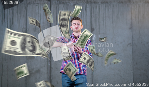 Image of businessman making the rain of money