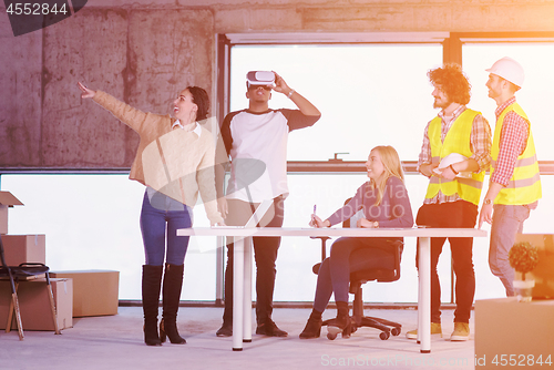 Image of group of multiethnic business people on construction site