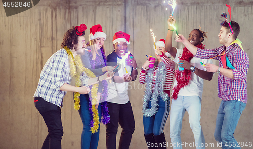 Image of multiethnic group of casual business people dancing with sparkle