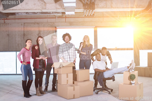 Image of portrait of multiethnic business people with sunlight through th