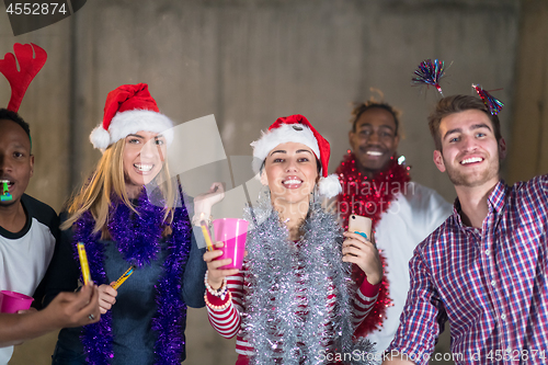 Image of multiethnic group of casual business people dancing with sparkle